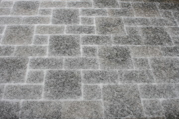 Hintergrund : Schnee auf den Pflastersteinen