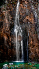 Fototapeta premium Colorful Waterfall within the National Park of Plitvive Lakes in Croatia