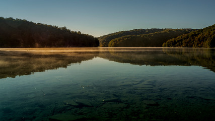 Misty Lakes at dawn within the colorful Plitvice National Park in Croatia