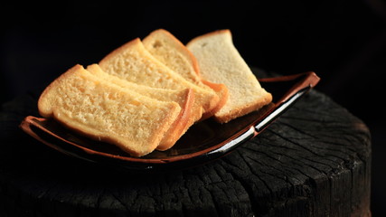 Bread on dark background wood