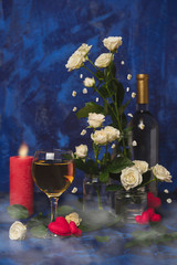 Valentine day. White wine. Romantic evening. Wine, a bunch of white roses and red hearts with smoke on a blue background. Holiday of lovers. A delicious alcoholic drink for two people.Picture magic
