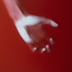 womanhand grab and hold something in red blood water, female tense hand, cover for art in horror...