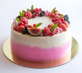 Biscuit cake with berries and flowers