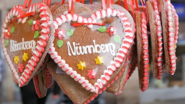 Traditional German Christmas multicolored painted gingerbread with the multicolored flowers and the inscription Nuremberg