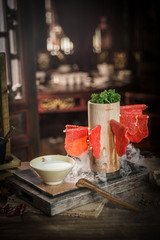 Hang up the fresh beef slices on the wood dish