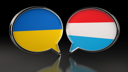 Ukraine and Luxembourg flags with Speech Bubbles. 3D illustration