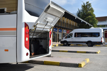 open back trunk of white middle bus
