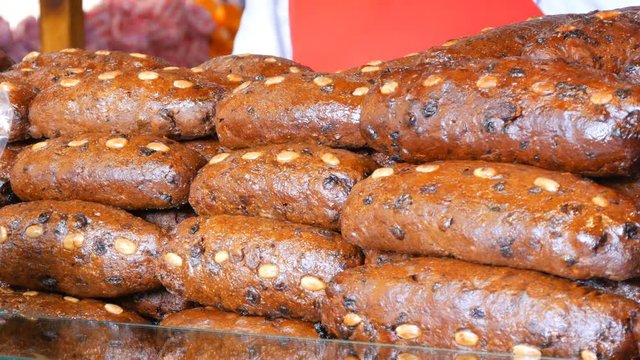 Chocolate traditional tortillas or lebkuchen of German Christmas market. Christmas baking is on the shop window