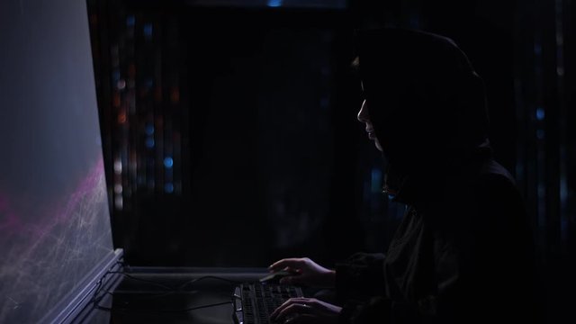 Woman hacking into the system in black jacket