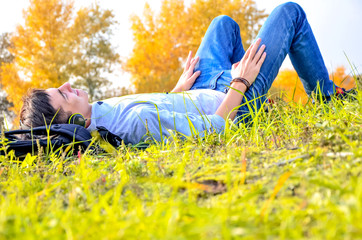young man in the field of flowers