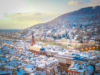 Aerial view of Heidelberg town and Neckar river in winter with snow from the castle in the...