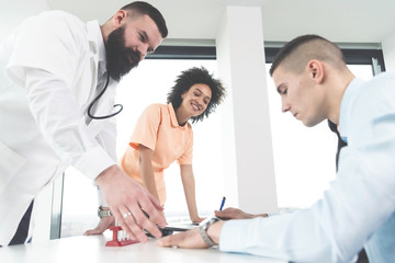 Fototapeta premium Patient signing the medical forms
