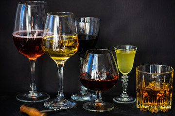 Glassed with drinks on dark background