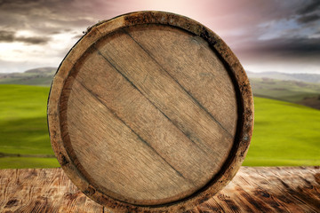 wooden barrel as a table with a free space for an advertising product, the hero on the background...