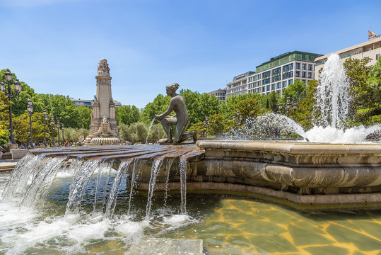 Madrid, Spain. The picturesque fountain in the square of Spain. In the background is the memorial of Cervantes