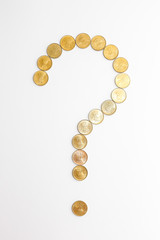 Close up view of new indian coins on white background. Question mark concept.
