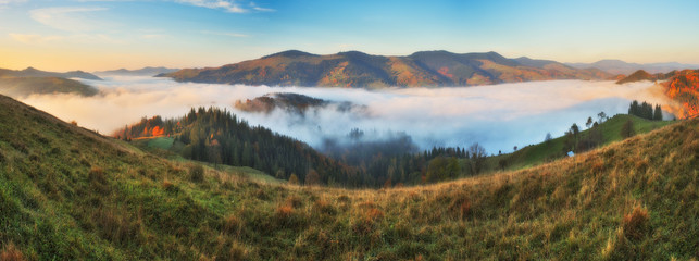 picturesque sunrise in the Carpathian mountains. autumn foggy morning