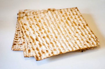 Jewish traditional Matso unleavened bread, matso bread is made during the Jewish Passover Pesach holiday. Pesach concept postcard.