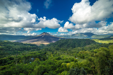 Panorama of Gunug Batur volcano at clouds on Bali island, Indonesia