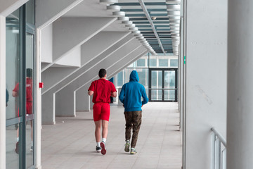 two friends runing and practice in the hall