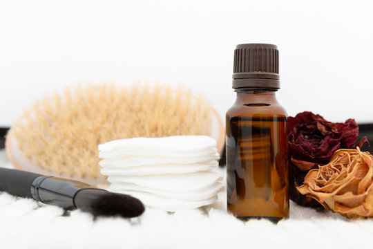 Aromatic botanical cosmetics. Dried herbs flowers mixture, body scrub brush, oils. Holistic herbal DIY skincare beauty hack