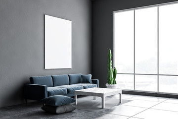 Gray living room corner, sofa and poster