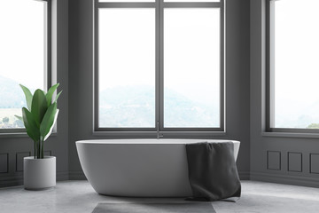 Fototapeta na wymiar Minimalistic gray bathroom interior, tub