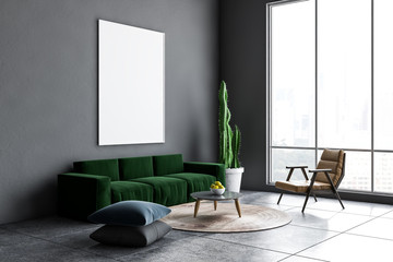 Gray living room corner, green sofa, poster