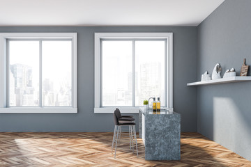 Side view of gray kitchen with bar