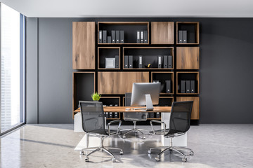 Gray ceo office interior, wooden bookcase