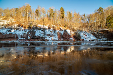 sandstone cliffs on the shore of river Gauja in Latvia