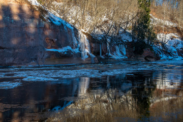 sandstone cliffs on the shore of river Gauja in Latvia