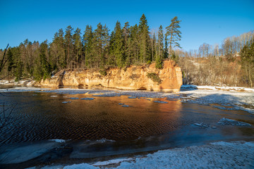 sandstone cliffs on the shore of river Gauja in Latvia