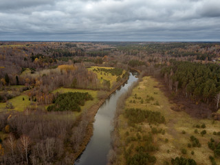 Fototapeta na wymiar drone image. aerial view of rural area with snake river in forest