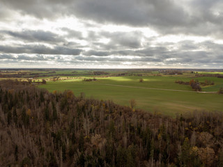 Obraz premium drone image. aerial view of rural area with snake river in forest