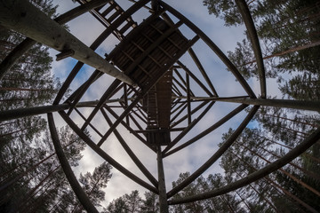 watchtower details and wooden bars, stairs and walls from below up