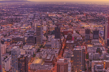 Aerial view of Los Angeles skyline in California, United States. Details of downtown of LA cityscape from observation deck on the 70th floor. Sunset light.