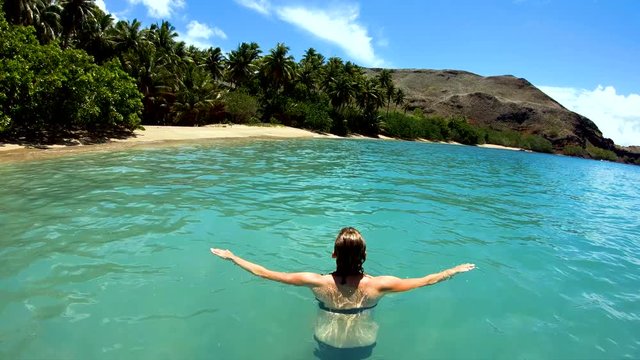 Tahuata Marquesas young female on deserted ocean beach