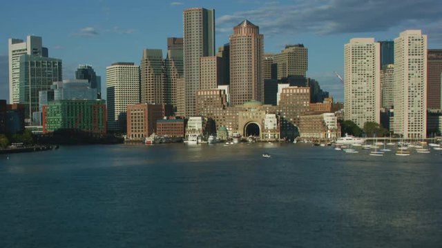 Aerial reveal view Rowes Wharf Boston skyscrapers America