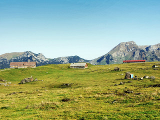 Stables and farms on the plateau beneath the mountain ranges Churfirsten - Canton of St. Gallen,...