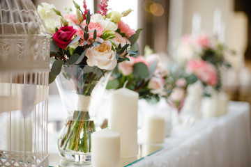 wedding mirror table with flowers and candles close to