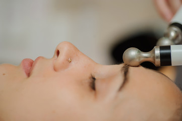Top macro close up view of women facial massage spa procedure