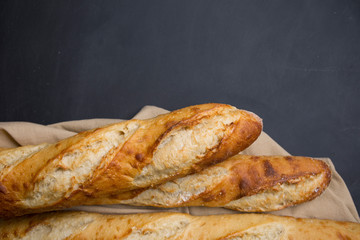 Close-Up Of Baguettes on cutting board with knife
