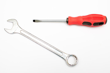 Black and red screwdriver isolated on white background. Screwdriver for repairing and tightening screws. Wrench. Tools for repair