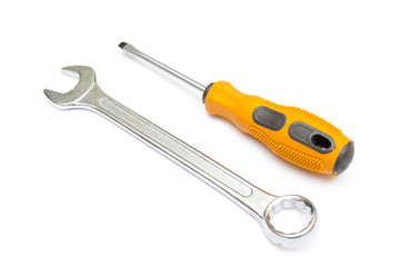 Black and orange screwdriver isolated on white background. Screwdriver for repairing and tightening screws. Wrench. Tools for repair