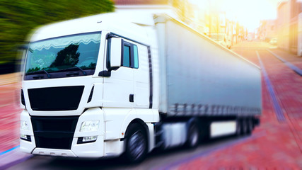 the truck in the city .Truck on the road . Commercial transport .  truck transport container