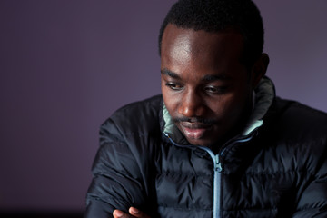 Obraz premium Dark african man posing with a sad expression