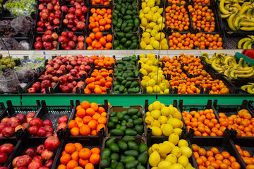 Boxes with fruit on the counter of shop..
