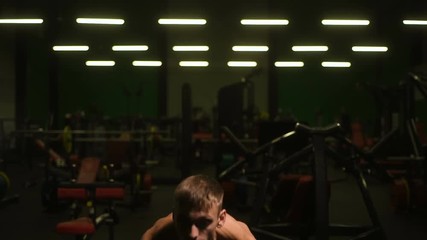 Weightlifting strong athletic men pumping up muscles workout fitness and bodybuilding concept background - muscular bodybuilder fitness men doing barbell military press exercises in gym naked torso