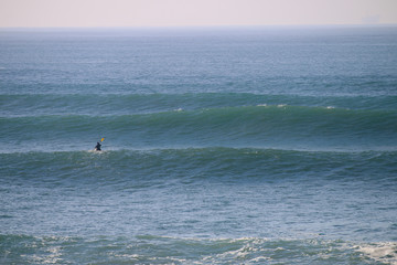 Ventura California Pier during super tide in winter on bright day